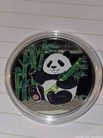 Front view showing enameled panda design