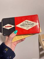 ACME red/black box front with board partially visible