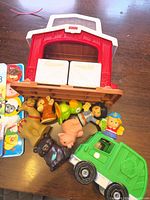 Group shot of barn, truck, figures and book