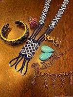 Overview of all six jewelry pieces on tabletop