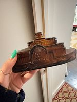 Side view showing steamboat shape and amber glass