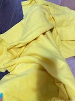 overall view of yellow fleece fabric spread out
