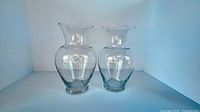 Front view of both clear glass vases