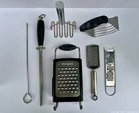All seven kitchen tools laid out front view