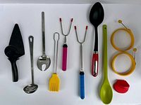 All eleven kitchen tools and marshmallow roasters laid out for overview
