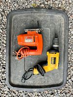 DeWalt drill and Black & Decker jigsaw placed on tray
