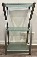 Front view of three-shelf glass and metal stand