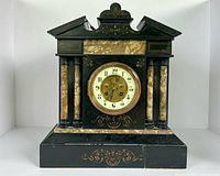 Full frontal view of marble mantle clock showing overall design and condition