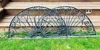 Both wrought iron panels side by side showing design and scale