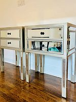 Both mirrored side tables front view showing drawers and legs