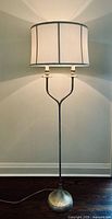 Full view of pewter floor lamp with silk shade
