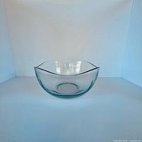 Front angled view of clear sculpted glass bowl