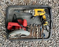 Overview of tray with Skil circular saw, DeWalt drill and drill bits