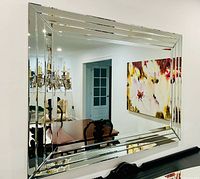 Front view of large rectangular mirror showing beveled mirrored frame
