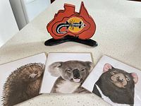 Front view of wooden ornament and three greeting cards