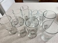 Front angled view of all 12 glass pieces showing shapes and sizes