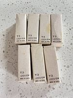 Seven boxed bulbs showing end panel markings T3 120V6W Made in Korea