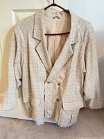 Front view of blazer showing overall style, color, pattern, buttons, lapels