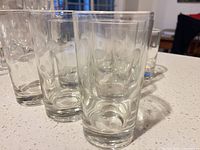 Group of polka-dot clear tumblers on countertop
