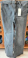 Full view DYNM Elodie grey denim jeans with tag attached