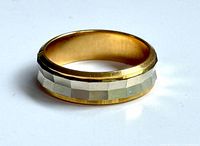 Close-up of single two-tone faceted ring