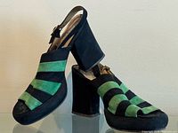 Full view of both platform slingback shoes showing striped uppers and block heels