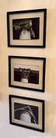 Three framed architectural column photo prints mounted vertically on wall