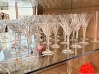 Group view of crystal stem glasses on shelf