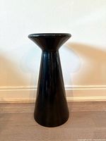 Full view of black ceramic pedestal stand
