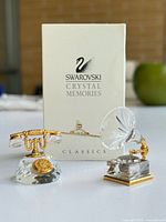 Boxed Swarovski Crystal Memories Classics with rotary telephone and phonograph figurines displayed