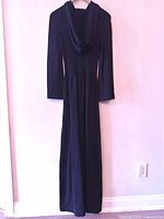 Full view of black hooded ribbed knit maxi dress on hanger