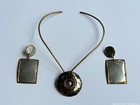Full view of necklace and both earrings