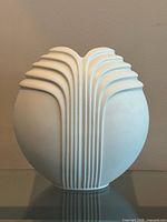 Front view showing ribbed relief and overall shape
