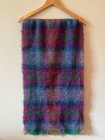 Full view of scarf hanging to show size and plaid pattern