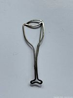 Front view of sterling wine glass brooch