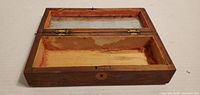 Box open showing interior compartments and mirror cavity