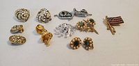 Full group of 13 costume jewellery pieces laid out