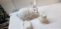 Rabbit, duckling, pedestal stand unpainted bisque ceramics