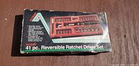 Front view of sealed Alltrade 41-piece reversible ratchet driver set box
