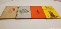 Four hardcover Paddington books front covers displayed
