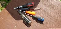 All five screwdrivers laid out showing handles and shafts