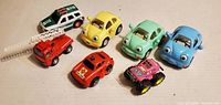 All seven plastic vehicles front left view