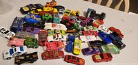Overhead view of entire lot of mixed die-cast cars on table