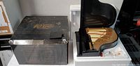 Outer box and piano decor piece in styrofoam insert