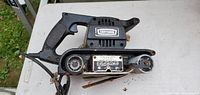 Right side view showing Craftsman branding, handle, belt track, power cord
