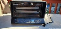 Front view of Cuisinart convection toaster oven broiler with control panel and cord