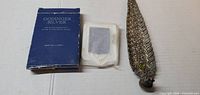 Box marked Godinger Silver Treasured Moments, sealed frame pack, ornate letter opener