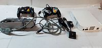 Full lot: Wii console, two controllers, power adapter, AV cable, sensor bar