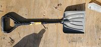 Full view of shovel showing D-grip, telescopic shaft and blade