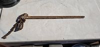 Full view of chain pipe wrench laid flat
